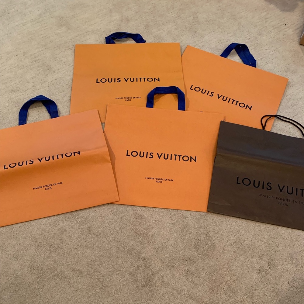 Lot of Louis Vuitton shopping bags